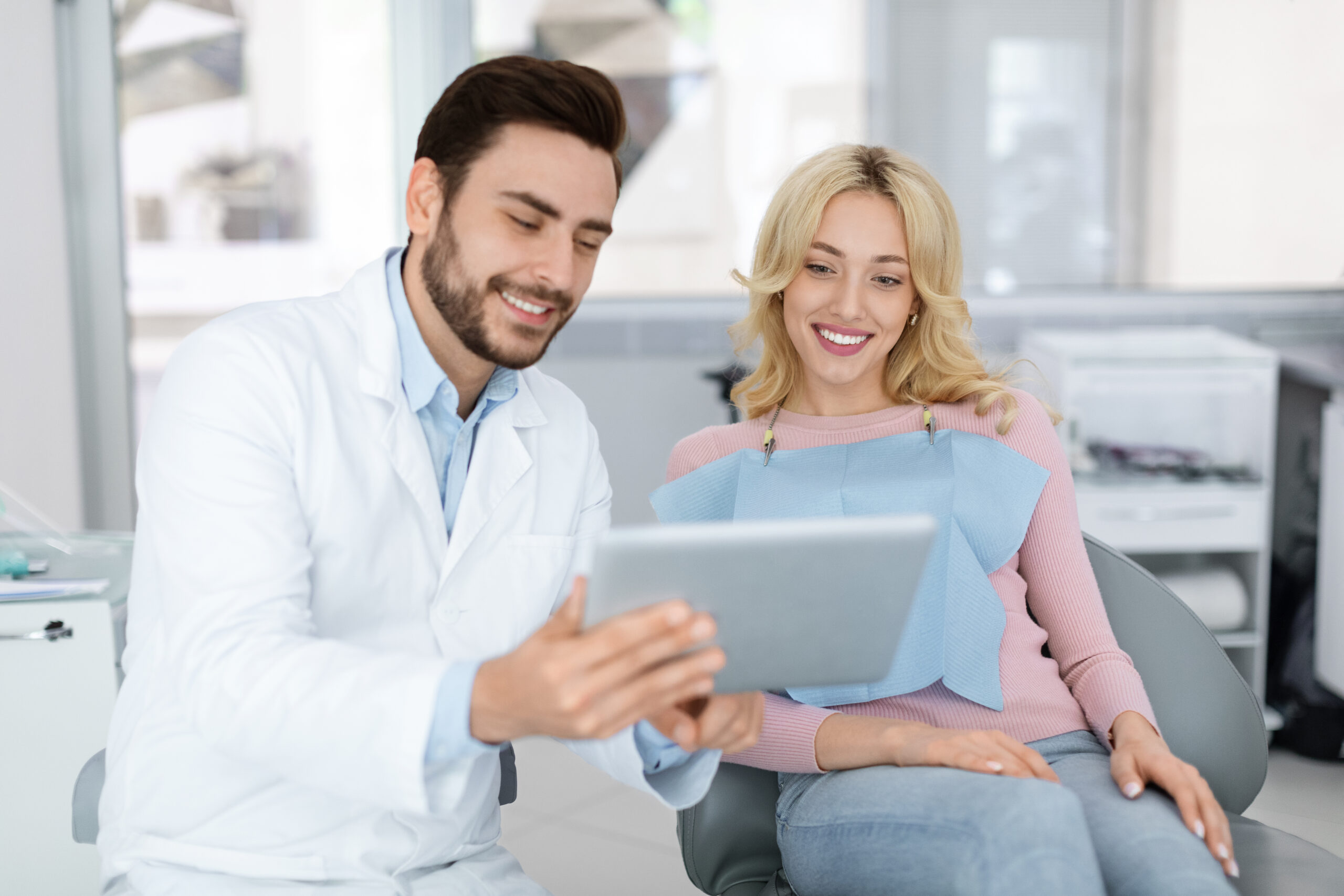 dentist discussing treatment with beautiful lady patient