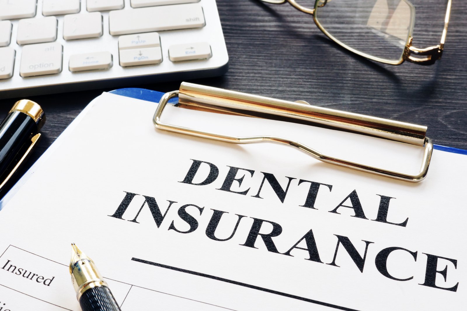 Dental insurance form and pen representing end-of-year Delta Dental benefits